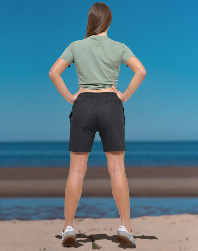 Unisex mercerised cotton shorts in dark colour, featuring a simple design and elastic waistband.