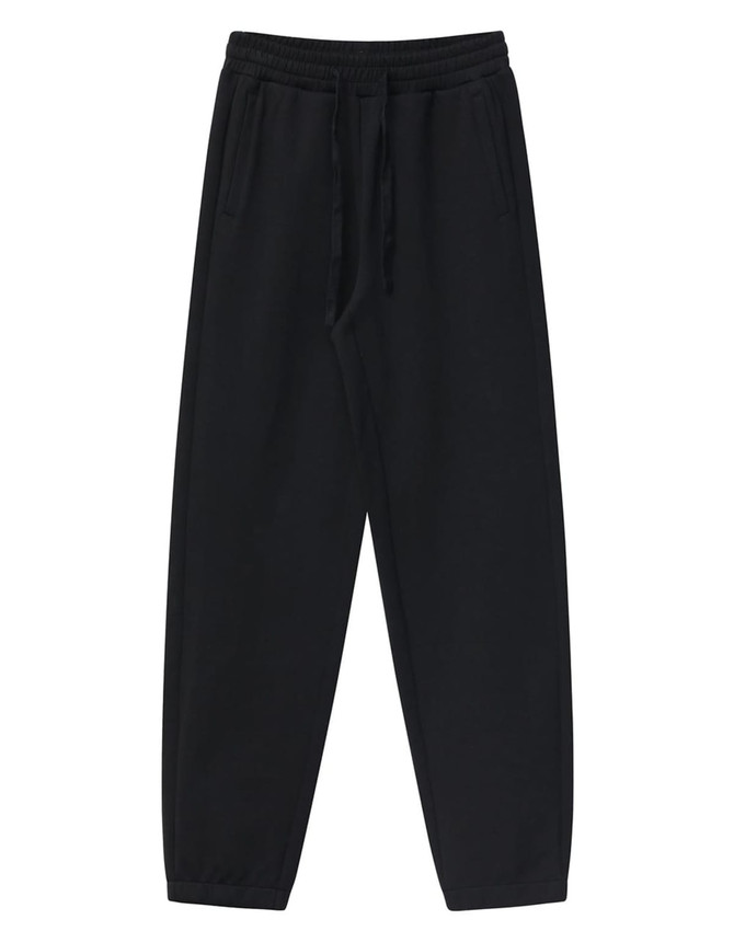 Black unisex sweatpants with an elastic waistband and side pockets, featuring a logo.