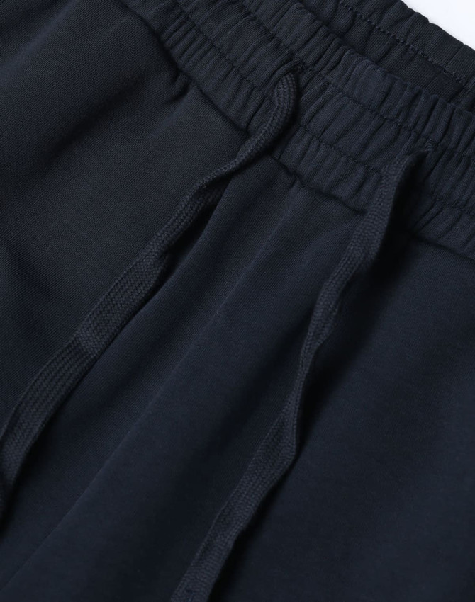 Unisex airlayered CVC sweatpants in navy blue with an elastic waistband and drawstring detail.