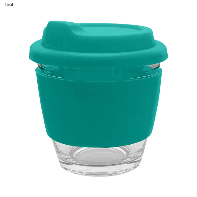 A teal reusable coffee cup with a silicone sleeve and lid, made from glass. It features a logo on the side.