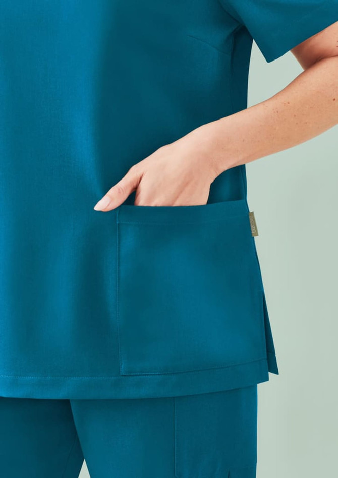 A women's teal V-neck scrub top featuring a side pocket, designed for comfort and utility in uniform apparel.