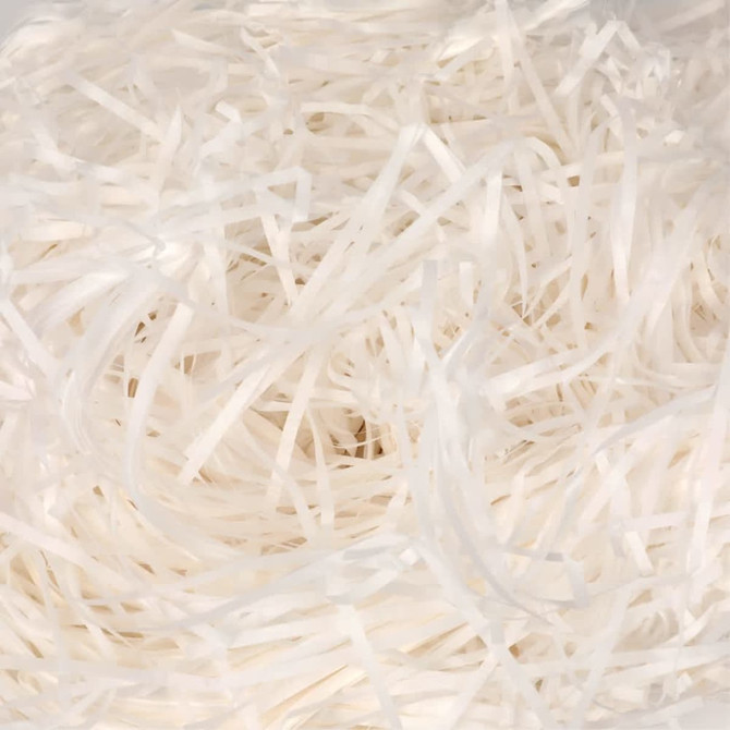 A white shredded filler material filling a gift box, creating a soft and decorative base.