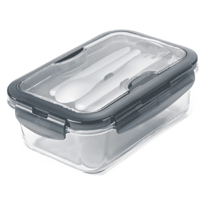 A clear lunch box with a grey lid, featuring a set of white utensils inside. The box has a secure sealing mechanism.