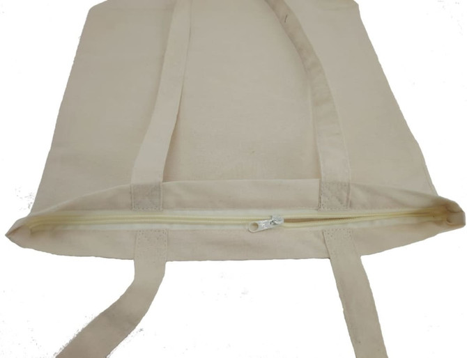 A canvas tote bag in a natural beige colour with a zipped top and two handles.