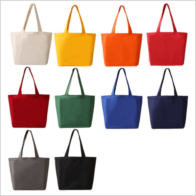A collection of ten tote bags in various colours, including beige, yellow, orange, red, green, blue, black, and grey. Each bag has two handles and a plain design.