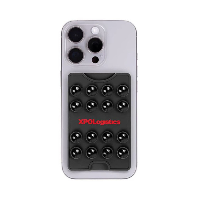 A sleek black suction phone wallet attached to a light-coloured smartphone, featuring a logo and circular suction cups.