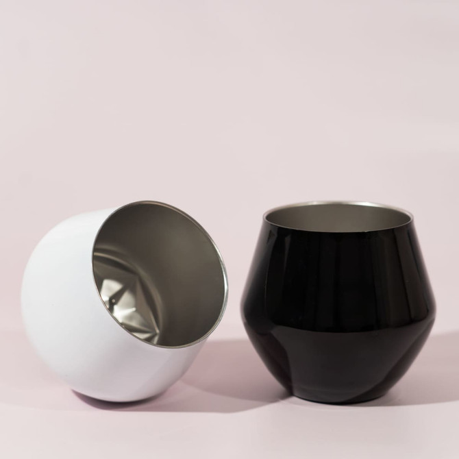 A detachable wine glass in black and white, featuring a sleek design with a shiny interior and matte exterior.