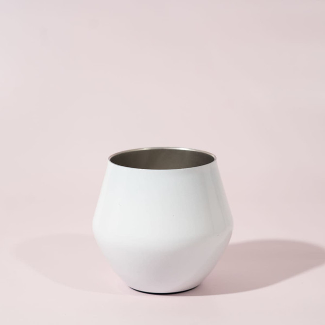 A white wine glass with a sleek, modern design featuring a metallic interior.