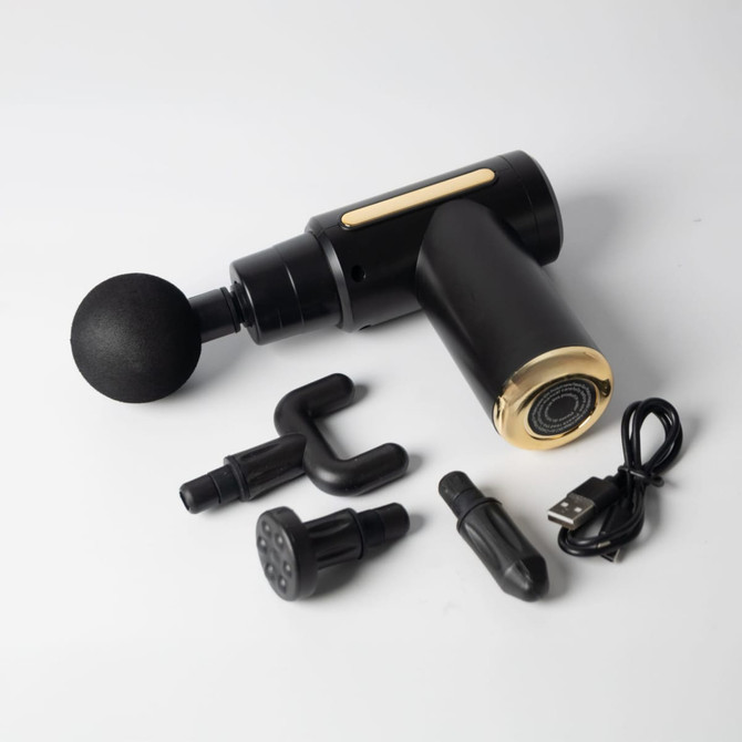 A black and gold massage gun with interchangeable heads and a USB charging cable. Includes a variety of attachments.