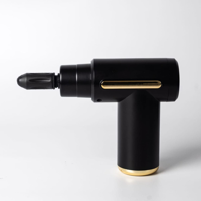 A black massage gun with gold accents, featuring a pointed attachment and a sleek, modern design.
