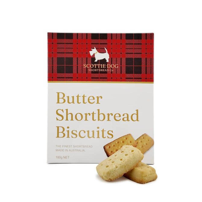A box of Scottie Dog butter shortbread biscuits with a red tartan design. Three biscuits are displayed in front of the box.