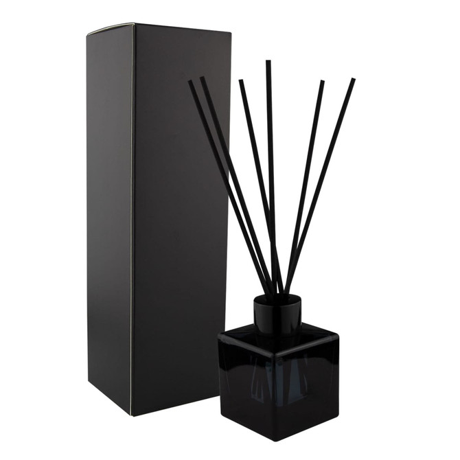A black square reed diffuser with black reeds and a matching box. Stylish and minimalistic design for home décor.