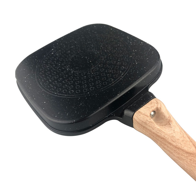 A square grill pan with a non-stick black surface and a wooden handle. It features a textured pattern on the base.
