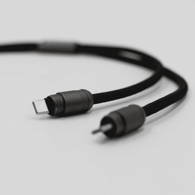 A black charging lanyard with connectors for data transfer and charging, featuring a sleek, durable design.