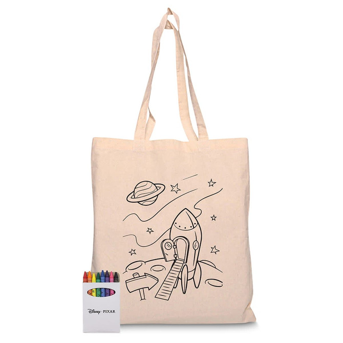 A cream tote bag featuring a rocket design and a crayon set with multiple colours.