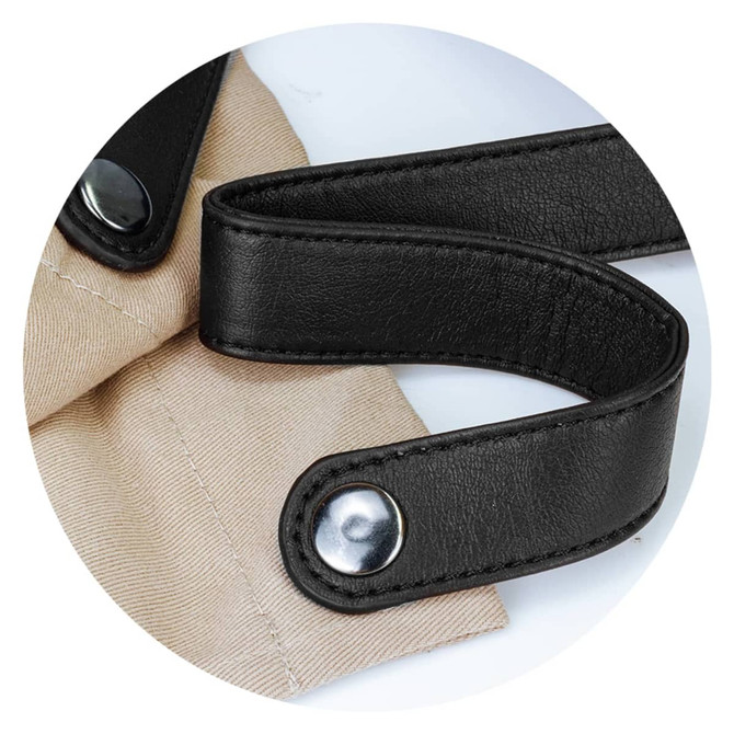 A beige apron with dark leather straps and metal fasteners, featuring stylish detailing and a logo.