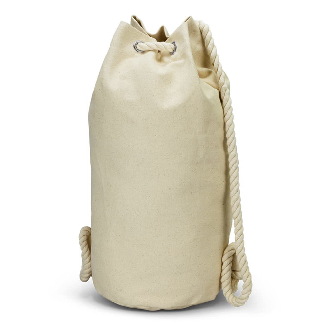 A cream-coloured canvas barrel bag with a rope drawstring closure and side handles. Features a logo.