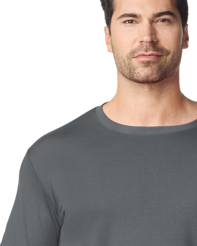 A grey adult t-shirt is displayed on a model, featuring a classic crew neck design and a subtle logo.