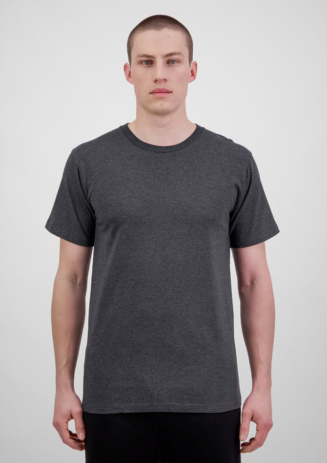 A grey short sleeve men’s tee worn by a model, featuring a simple design and no visible logos.