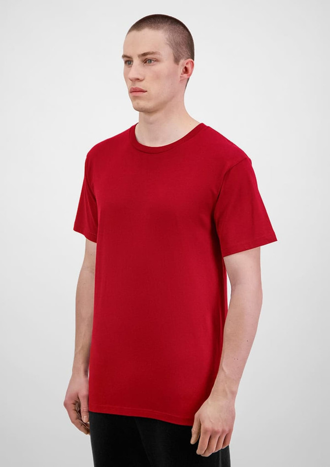 A red men's short sleeve t-shirt displayed on a model, featuring a simple design and a straight cut.
