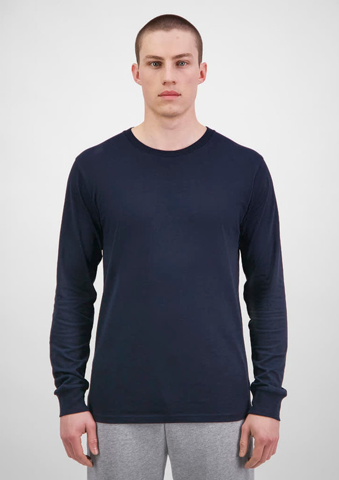 A long sleeve tee in navy blue, displayed on a model against a plain background. The garment has a logo.