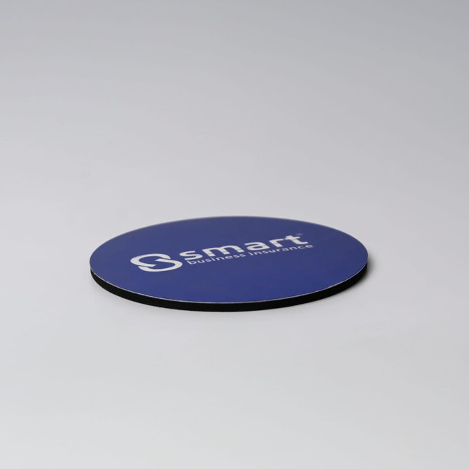 A round blue coaster with a black edge and a logo on the surface.