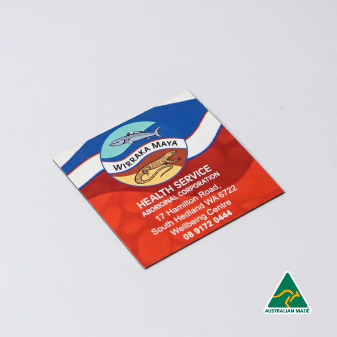 A square fridge magnet featuring a colourful design with a logo, predominantly in red, blue, and white.