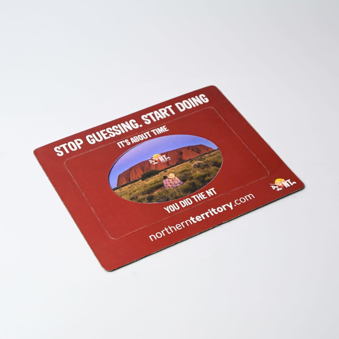 A red magnetic photo frame featuring a circular cutout for images, with a scenic backdrop and a logo.