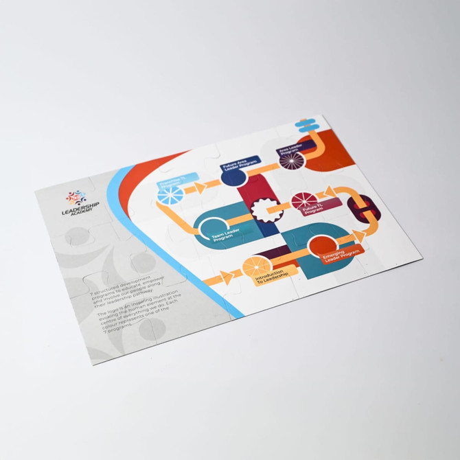 A colourful magnetic jigsaw featuring various shapes and patterns, with a sleek design and a logo in the corner.