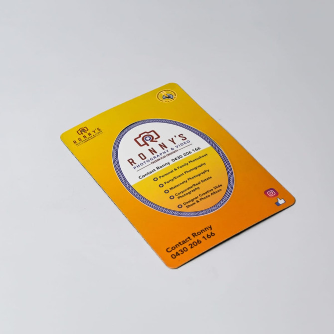 A magnetic photo frame in vibrant yellow with a rounded design, featuring a logo and contact details.