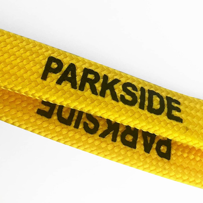 A yellow tubular lanyard featuring black lettering and a logo, ideal for events and exhibitions.