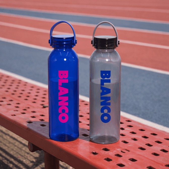 A drink bottle set featuring a blue and a clear design, both with a logo and cap, resting on a bench.