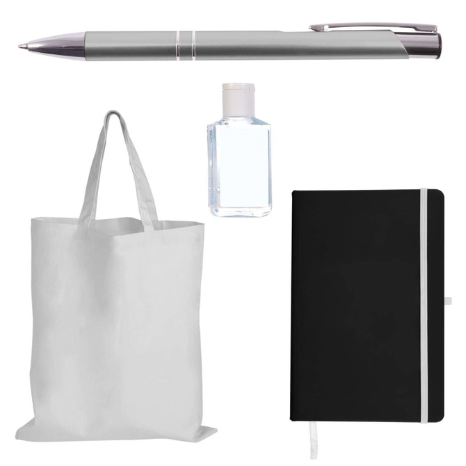 A silver pen, a clear hand sanitizer bottle, a black notebook with an elastic band, and a plain white tote bag.