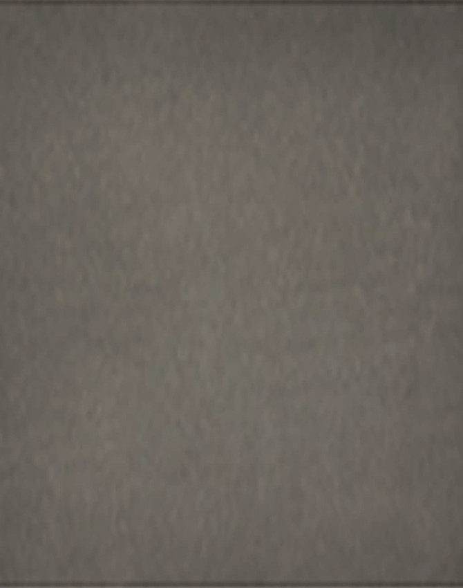 A grey removable knee pad with a branded logo. The surface appears textured and durable for various applications.