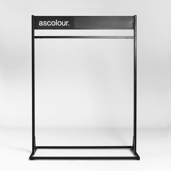 A garment rack in black with a mesh top and a logo. The design is sleek and modern, ideal for displaying clothes.