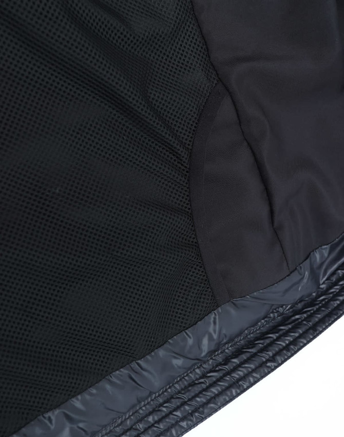 A black lightweight hooded puffer jacket featuring mesh panels and smooth fabric, with a logo present.