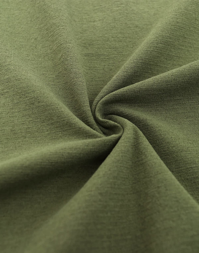 High-performance polo fabric in a muted olive green hue, featuring a smooth texture and a spiral pattern.