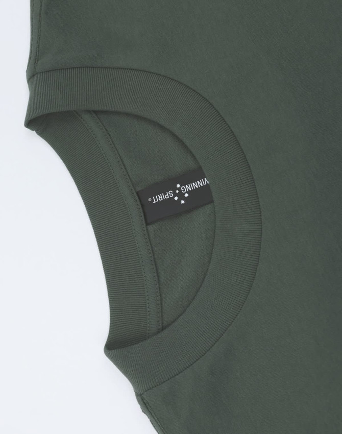 An olive green unisex oversized tee featuring a round neckline and a label on the side.