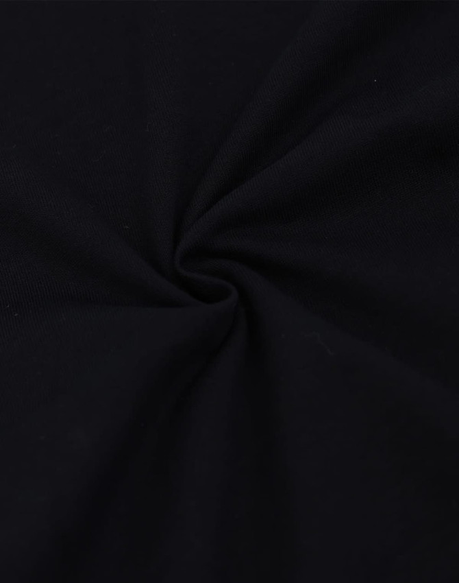 A dark black oversized tee made from heavy cotton, featuring a smooth, twisted fabric texture.
