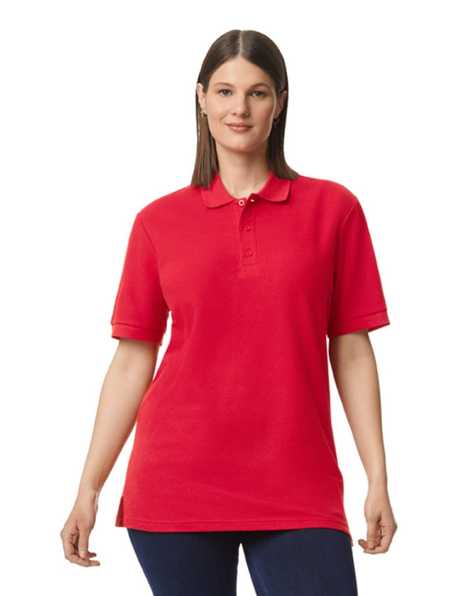 A red Gildan Hammer Adult Double Pique Polo shirt with a collar and a logo, displayed on a model.
