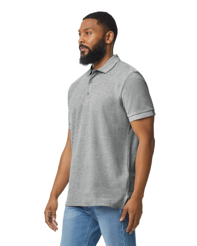 A grey Gildan Hammer Adult Double Pique Polo, featuring a collar and short sleeves, worn by a man.