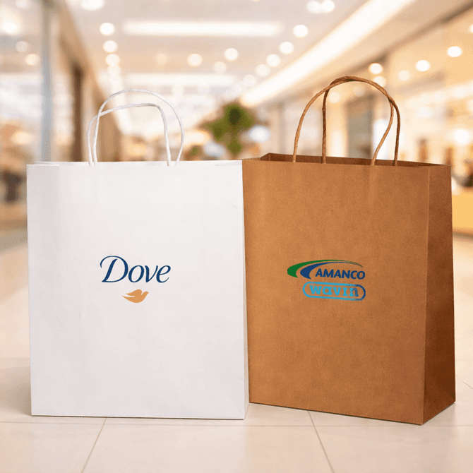 Two paper shopping bags are displayed, one white with a logo and the other brown with a logo, set in a retail environment.