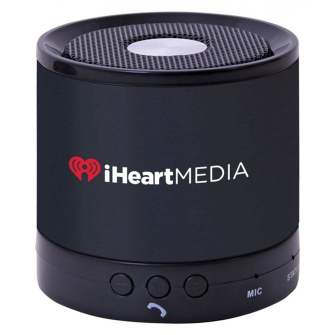 A black portable speaker with a mesh top and a logo on the front, featuring control buttons on the base.