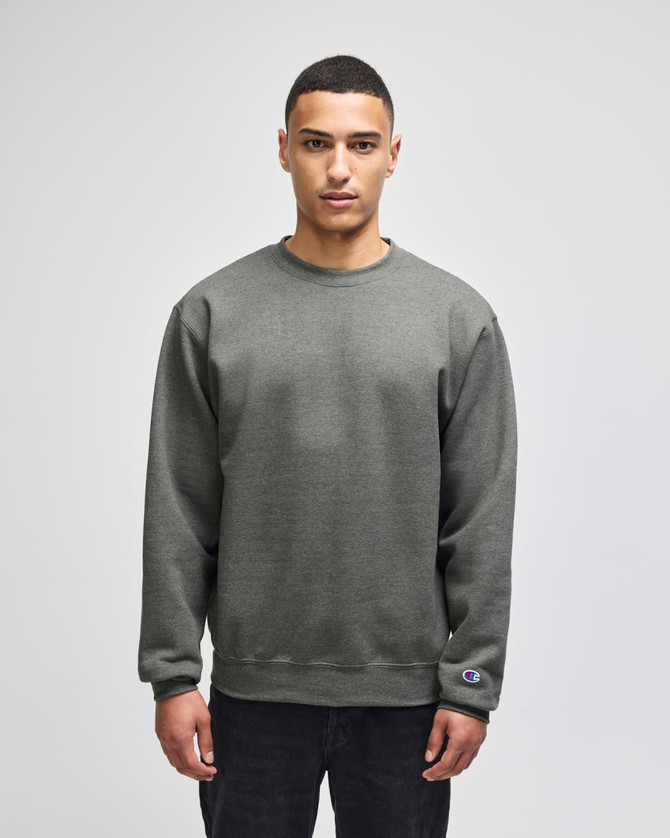 A grey sweatshirt featuring a crewneck design and a logo on the sleeve.