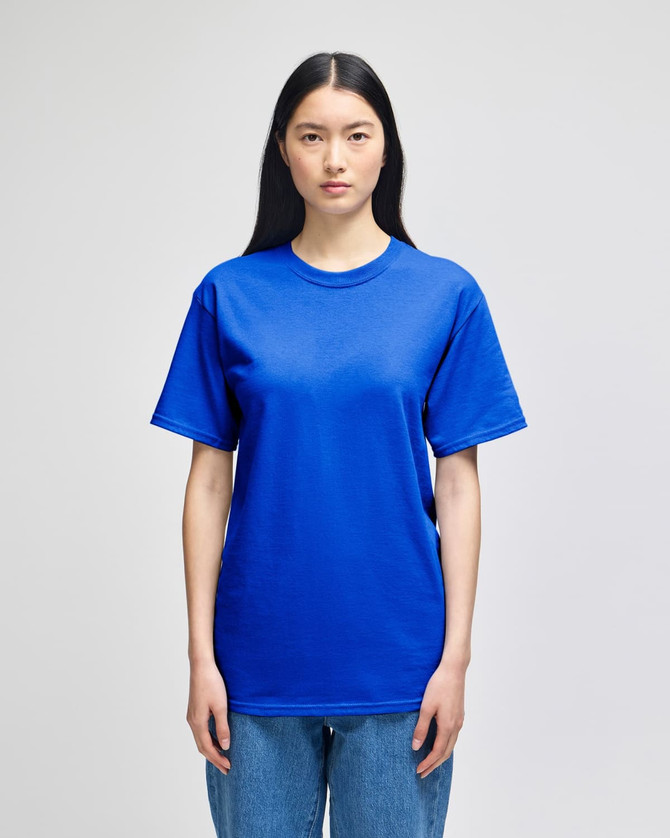 A blue adult short-sleeve t-shirt on a model, featuring a relaxed fit and a simple design.