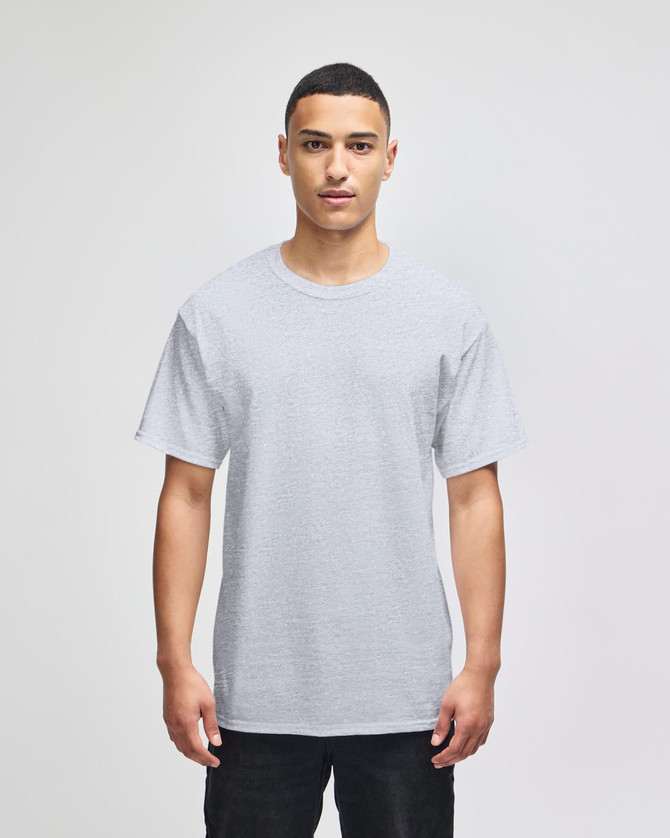 A grey Champion adult short-sleeve t-shirt displayed on a model. The shirt features a logo.