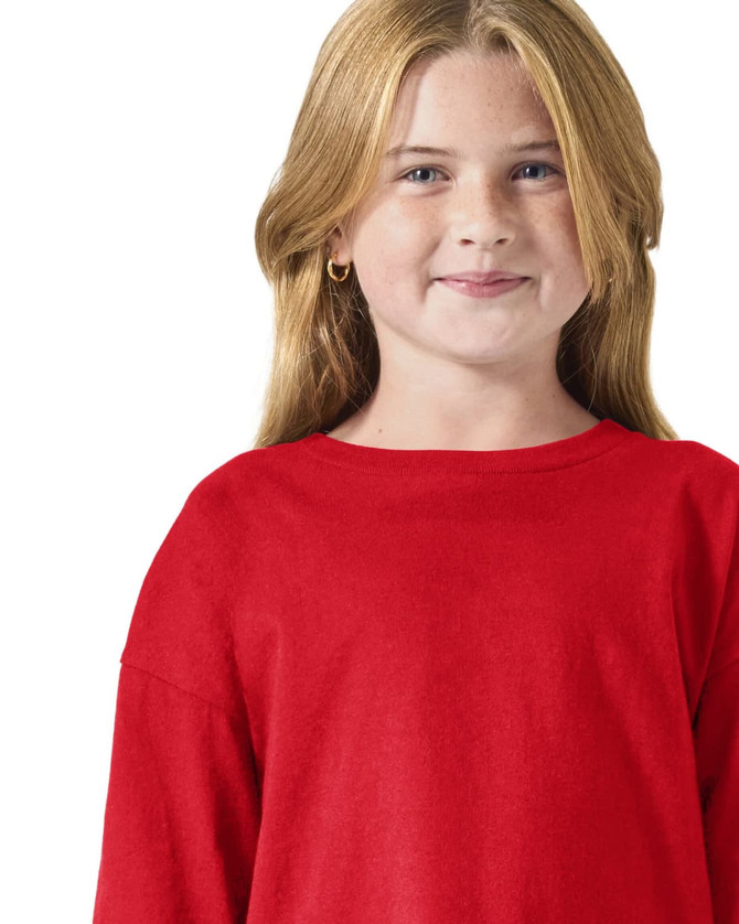 A red long sleeve t-shirt featuring a logo, worn by a child with blonde hair.