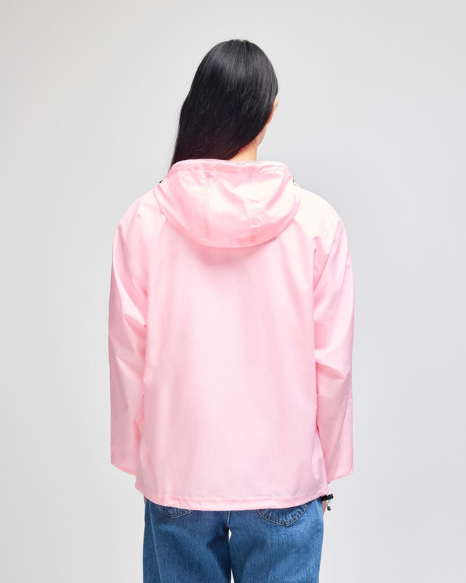 A pink packable anorak jacket featuring a hood, viewed from the back, with a logo on the sleeve.