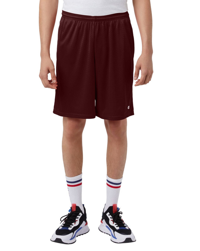 Maroon sports shorts with pockets, featuring an elastic waistband. Worn with white socks and black athletic shoes.