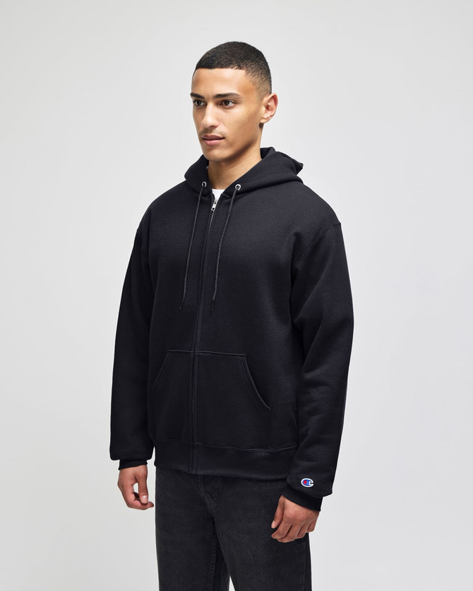 A black full-zip hooded sweatshirt featuring a logo, shown on a model standing straight.